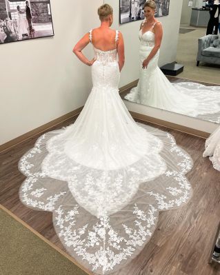Camille by Mori Lee, style 2379, pictured with detachable over train at Emmy's Bridal. floral lace straps, corsette top